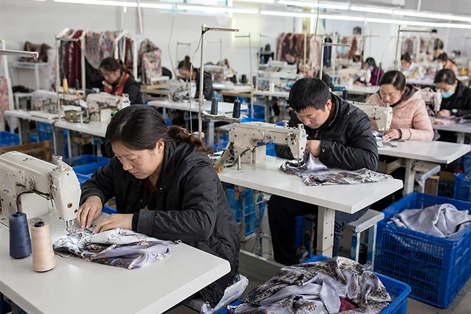 experienced workers sewing and finishing custom silk products