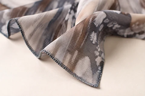 machine-triangle-hem-scarf-edge Machine triangle hem detail on a custom museum scarf