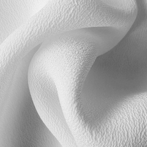 Printed viscose crepe fabric with a textured drape direction