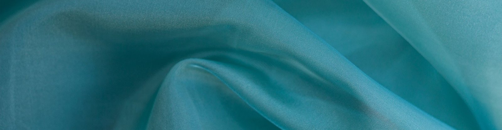 Silk organza fabric rolls and crisp sheer surface for a custom fabric program