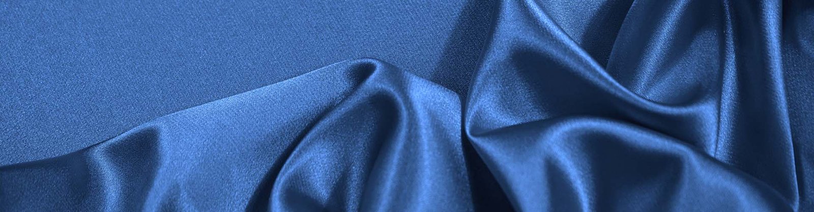 silk satin fabric overview Silk satin fabric rolls and surface detail for a custom fabric program
