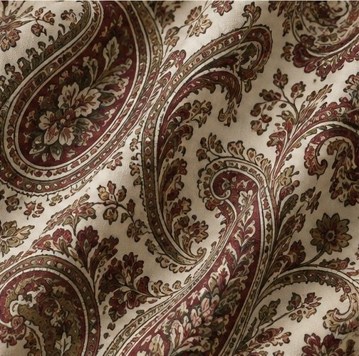 Paisley fabric pattern swatch with scrolling teardrop motifs