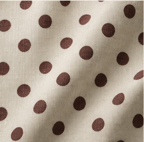 Polka dot fabric pattern swatch with evenly spaced round motifs