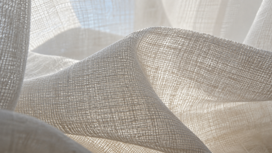 Close-up of fine voile yarns and open plain weave