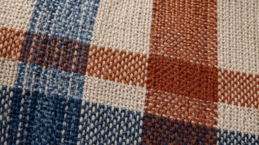 Close-up of yarn-dyed woven fabric with coloured warp and weft yarns